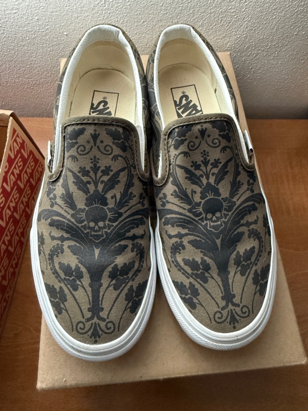 Vans Slip-On Canvas Sneakers in Olive Green and Black Damask Skull Print